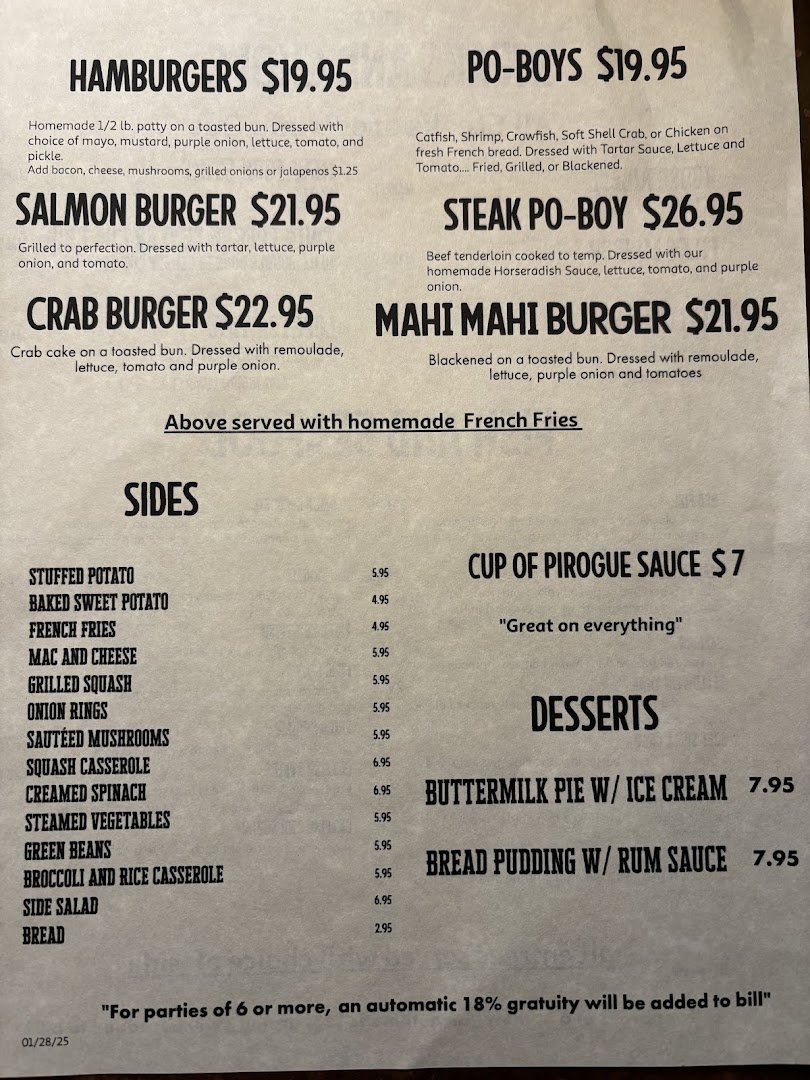 Plated steak with a side of seafood.
