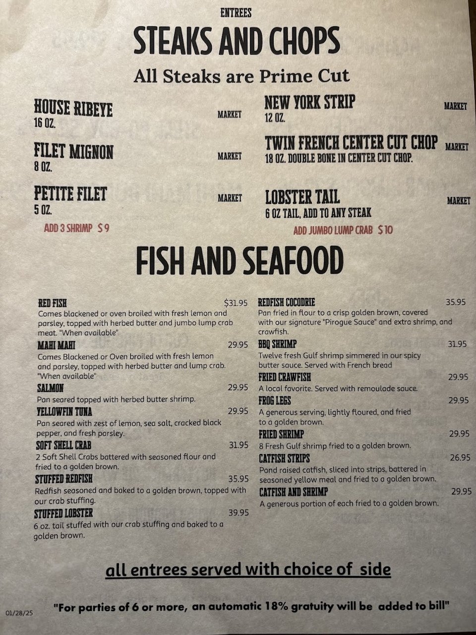 Seafood and steak dishes listed on a printed menu.